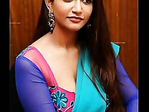 Desi beauty teases with her navel in a sexy saree, showcasing her Indian charm and sensuality.