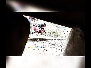 Indian mature woman urinates on a bed in a hardcore porn scene.